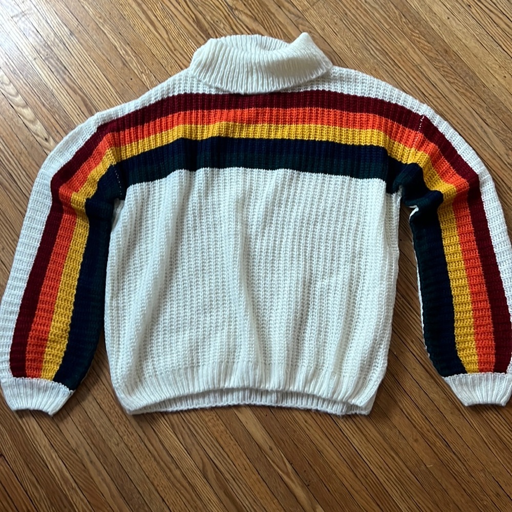 Small knitted sweater. Never been worn.